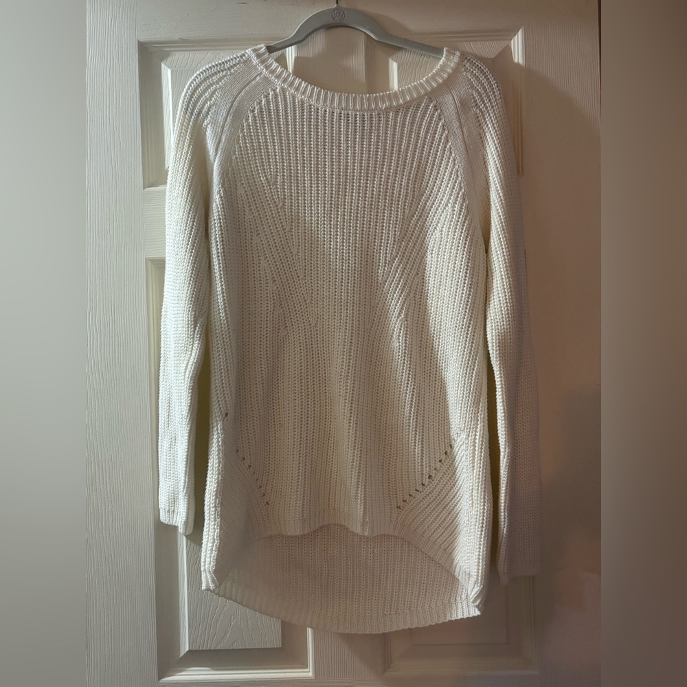 Cream sweater, never worn. Slightly longer in the back so great with leggings.